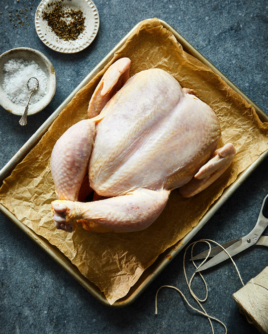 A pasture-raised whole chicken from Meremont, ready to roast
